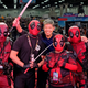 Rob Liefeld poses with Deadpool character cosplayers onstage Stan Lee’s Los Angeles Comic Con 2017.